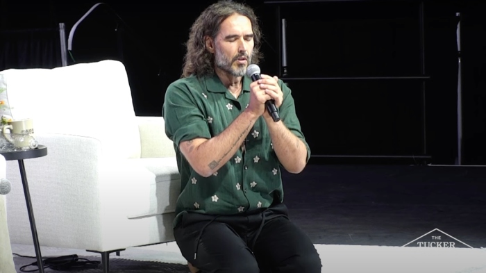 Russell Brand accompanied by man baptized with him at court hearing for sexual assault charges